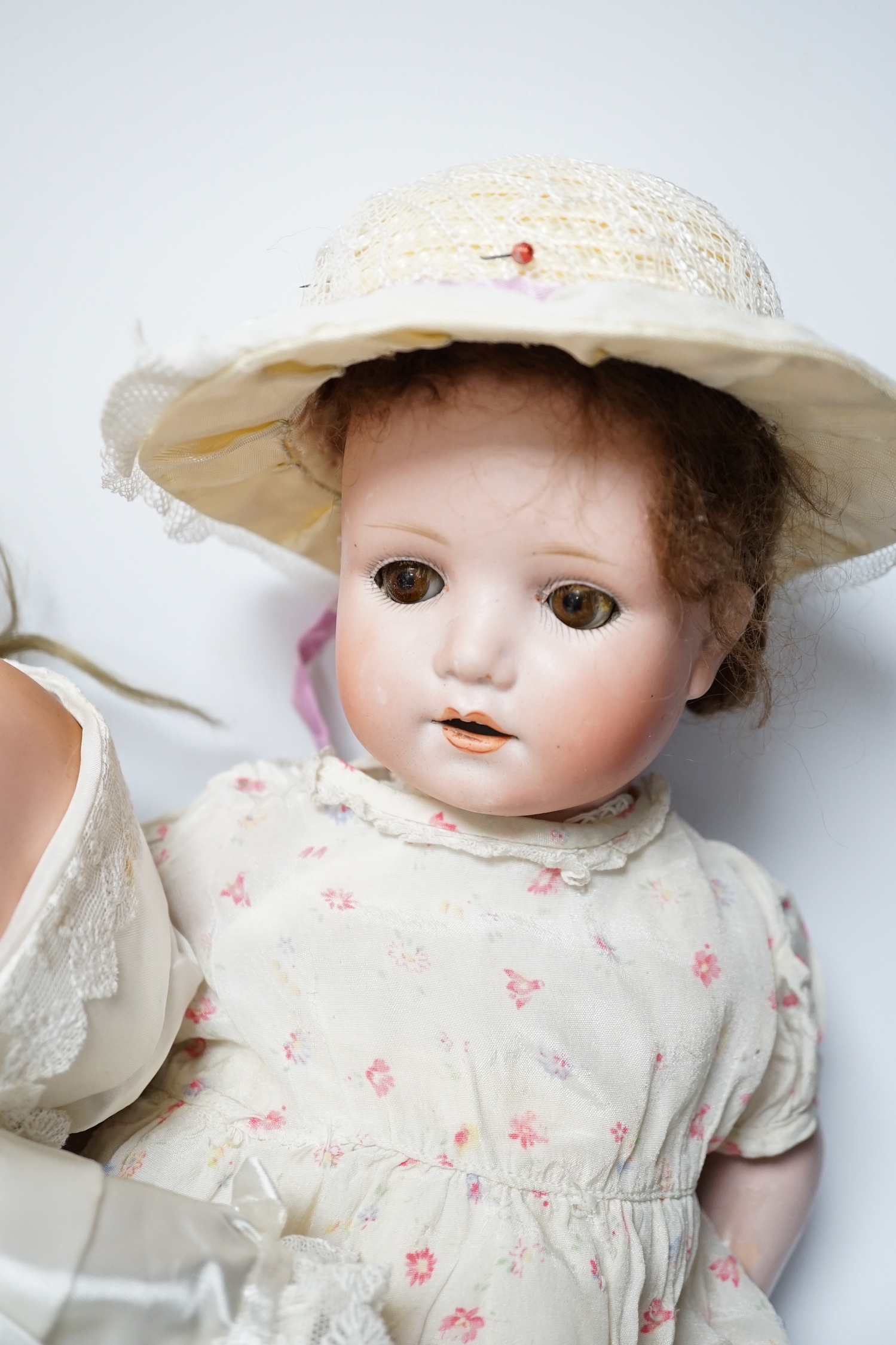 A Dream Baby AM341 closed mouth doll, 40cm, and a Dream Baby AM341 with celluloid hands, 40cm